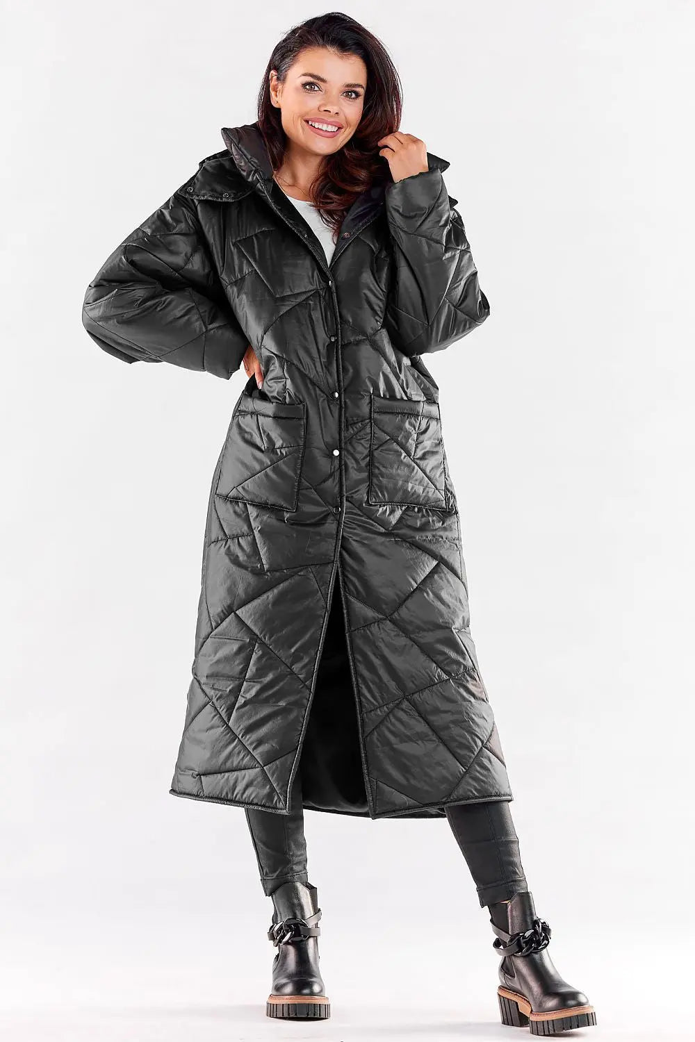 Elegant long quilted coat for women with hood, pockets, and press stud closure in black polyester