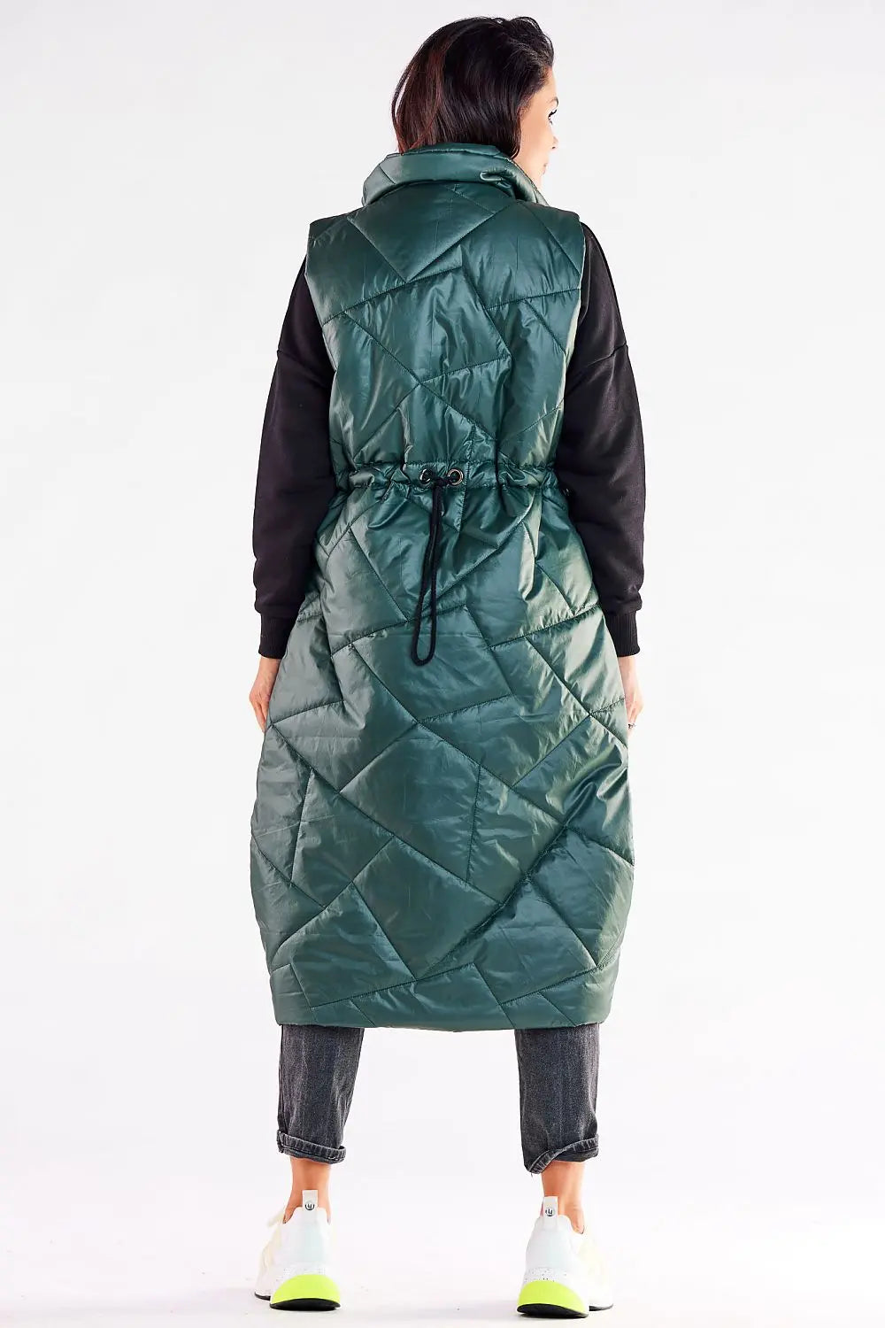 Back view of a stylish women's oversized quilted vest in green with adjustable waist and zipper closure.
