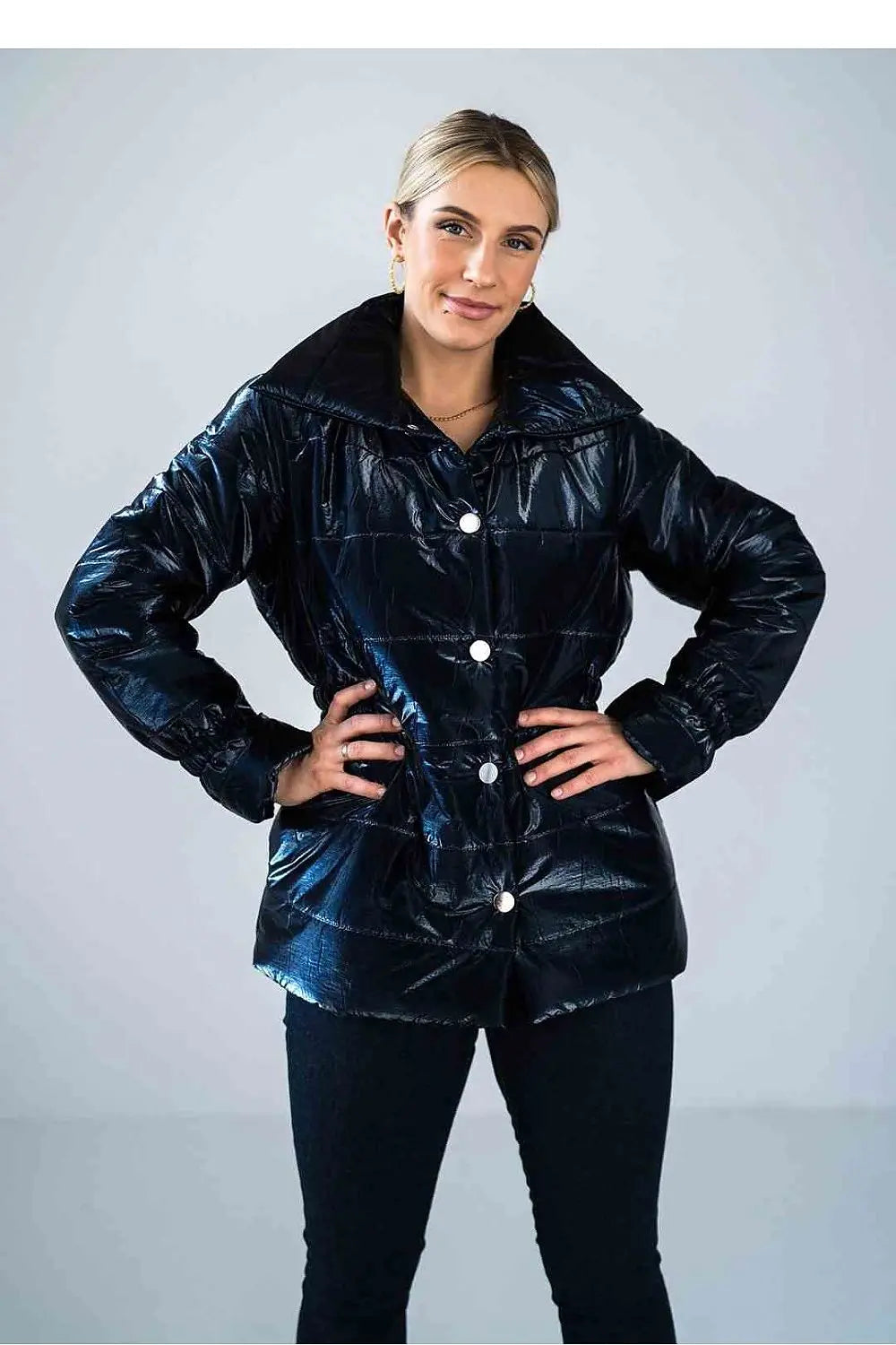 Women’s shiny quilted hip-length jacket with high collar and press stud buttons