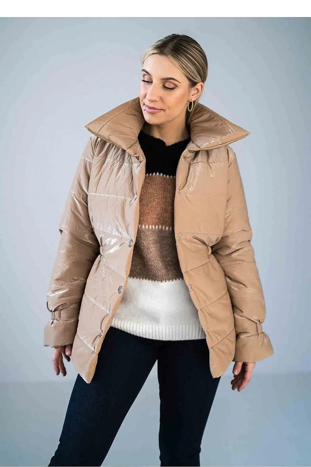 Women’s shiny quilted hip-length jacket with high collar and press studs fastening