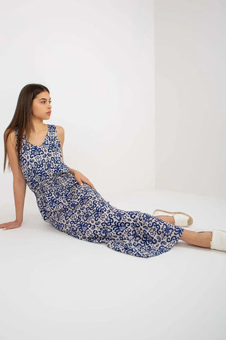 Summer floral dress with thick straps and heart neckline, featuring a cinched waist and ruffled hem.