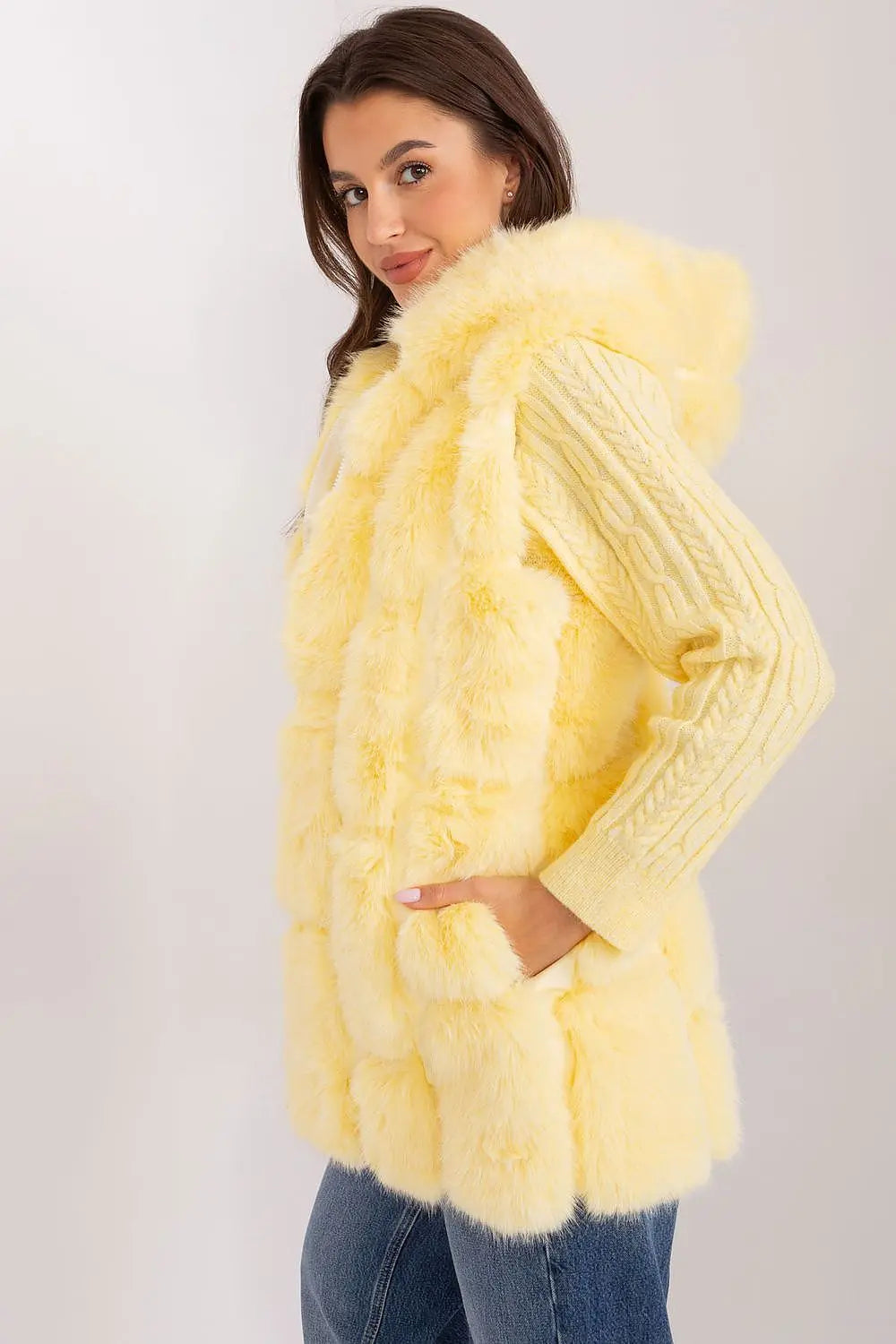 Elegant women's hooded faux fur vest in soft yellow polyester with pockets and zipper closure