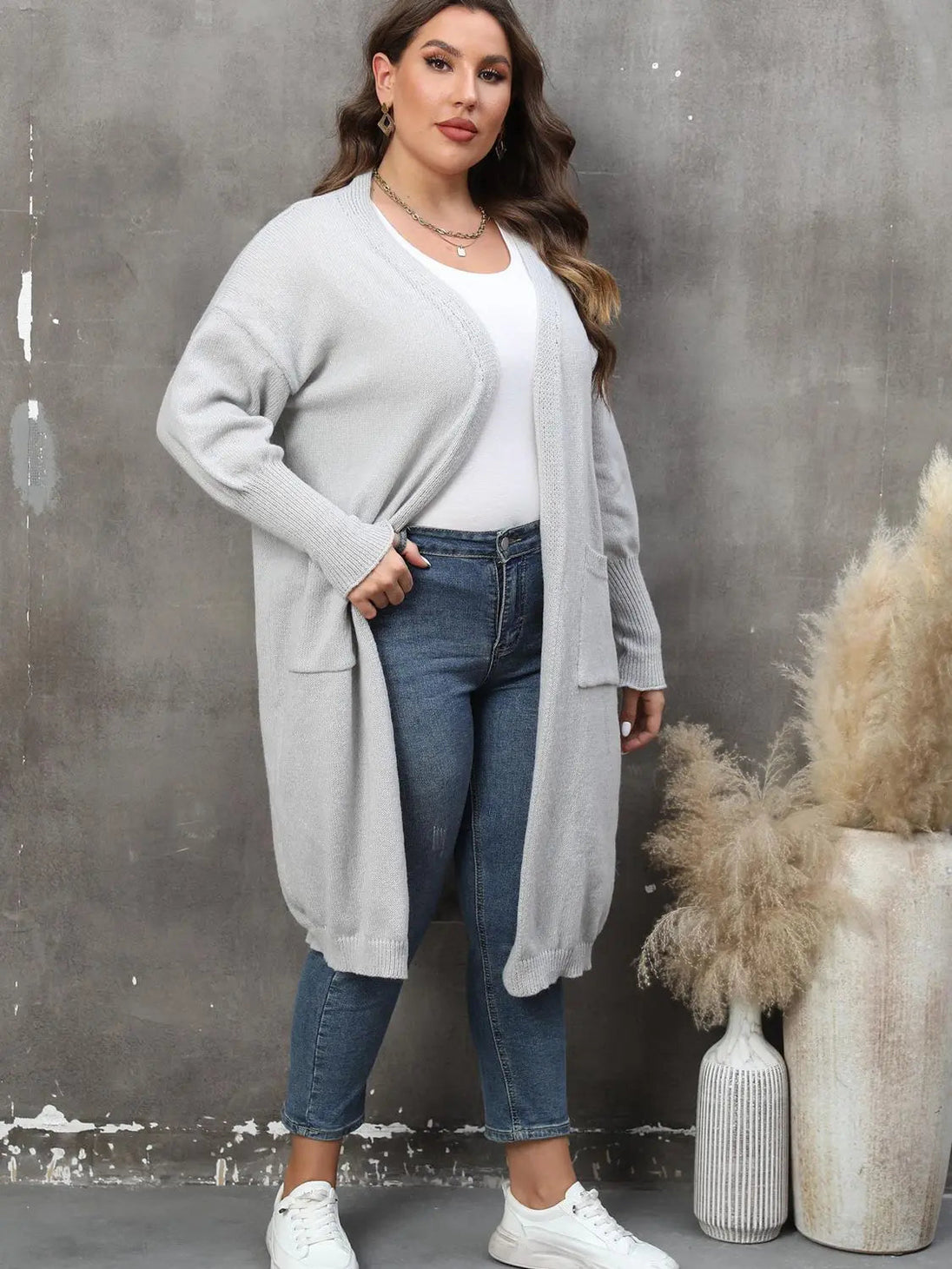 Plus size long sleeve pocketed cardigan in light grey with open front and ribbed texture