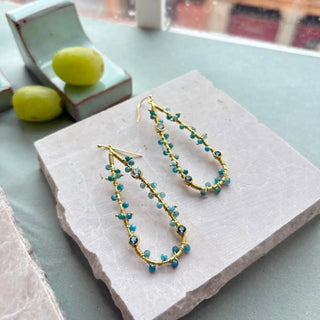 Hydra Large Teardrop wire-wrapped earrings with iolite, blue topaz, and apatite gemstones on 22k gold recycled brass