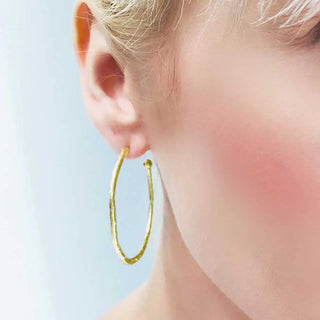 Lydia Large Textured Gold Hoops worn on ear, handcrafted 22K gold plated textured large hoop earrings, diameter 38mm, elegant and stylish jewelry accessory