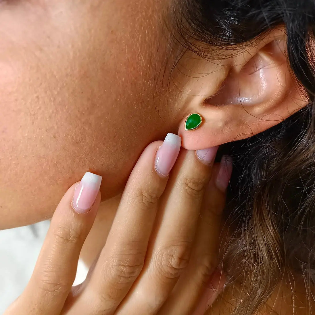Simi Gemstone Studs handcrafted 22K gold green onyx teardrop earrings worn on ear