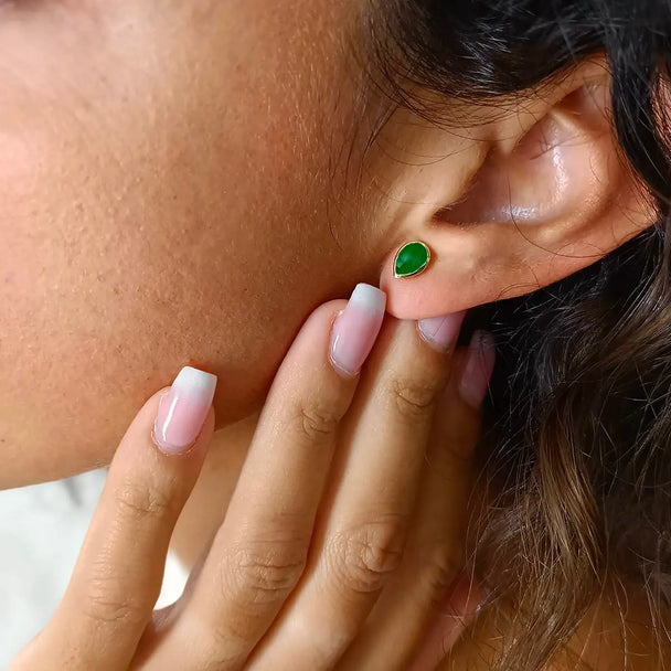 Simi Gemstone Studs handcrafted 22K gold green onyx teardrop earrings worn on ear