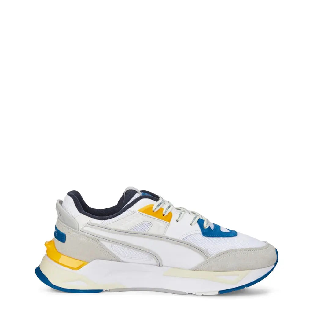 Puma MIRAGE-SPORT Sneakers in white with yellow and blue accents, suede and mesh upper, round toe, lightweight cushioned sole with rubber outsole.