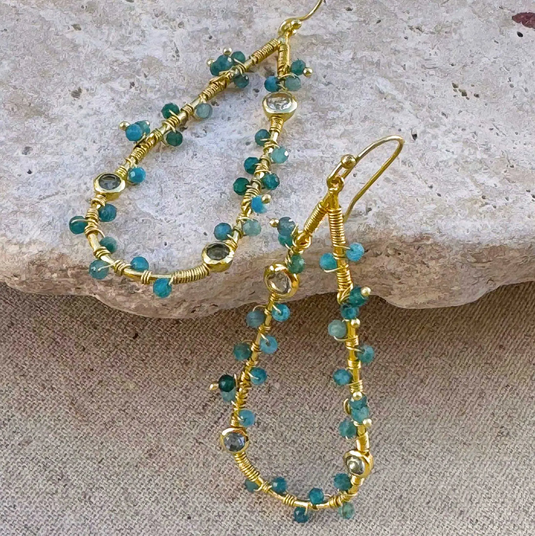 Hydra Large Teardrop wire-wrapped gold earrings with Iolite, Blue Topaz, and Apatite gemstones