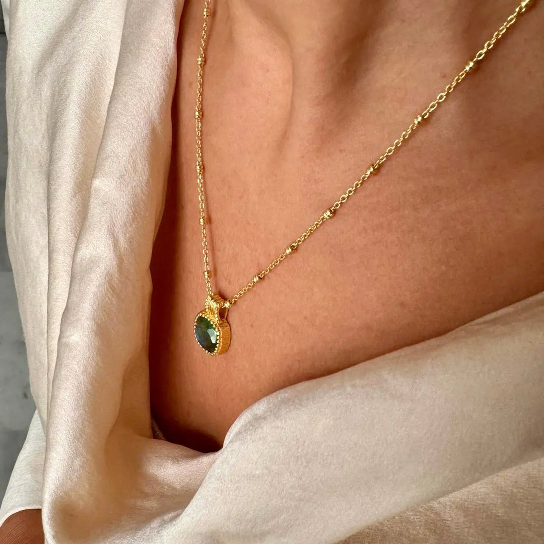 Tetra square gemstone pendant with amazonite set in textured gold on adjustable sterling silver chain worn on neck