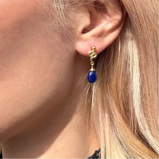 Medusa small gemstone drop earrings with lapis teardrop and 22k gold on brass detail worn on ear